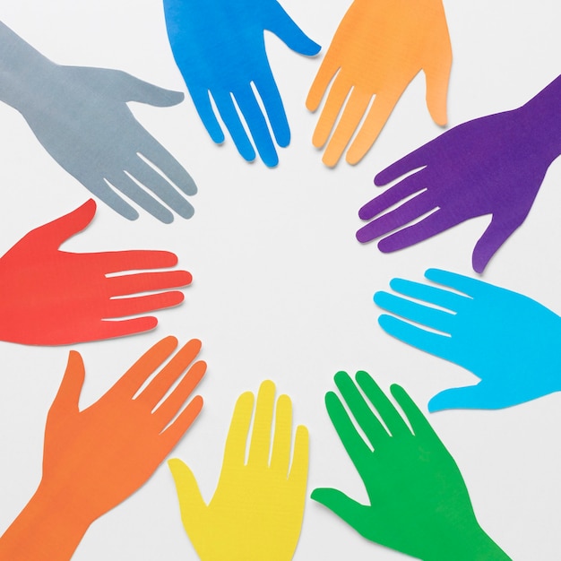 Free photo diversity arrangement with different colored paper hands