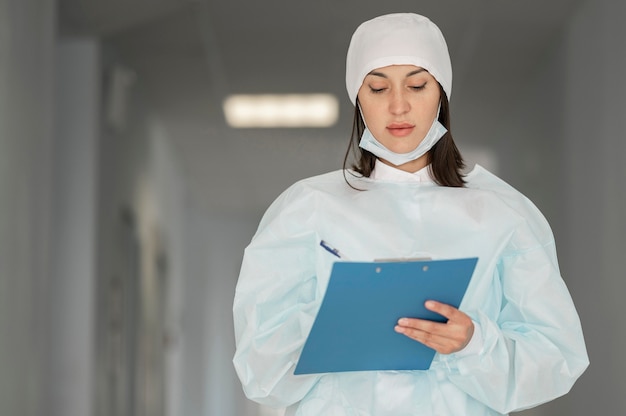 Doctor checking medical form at the hospital