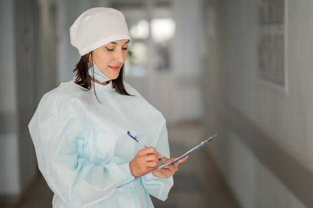 Doctor checking medical form at the hospital