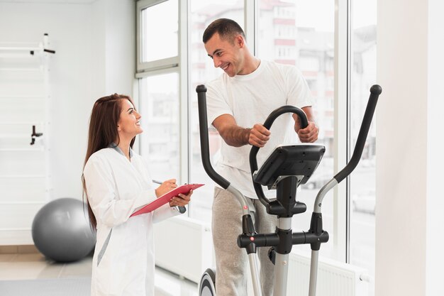 Doctor checking patient doing exercises