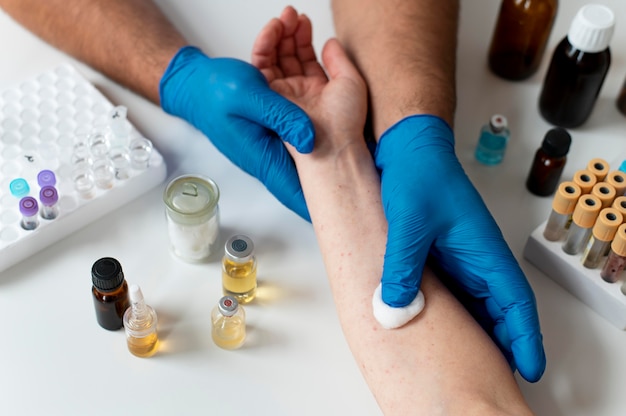 Free Photo doctor checking a person's skin allergy