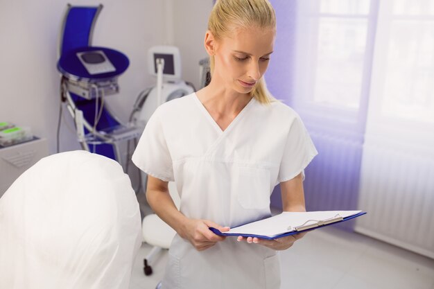 Doctor checking the reports at clinic