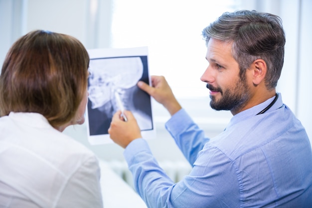 Doctor discussing x-ray with patient