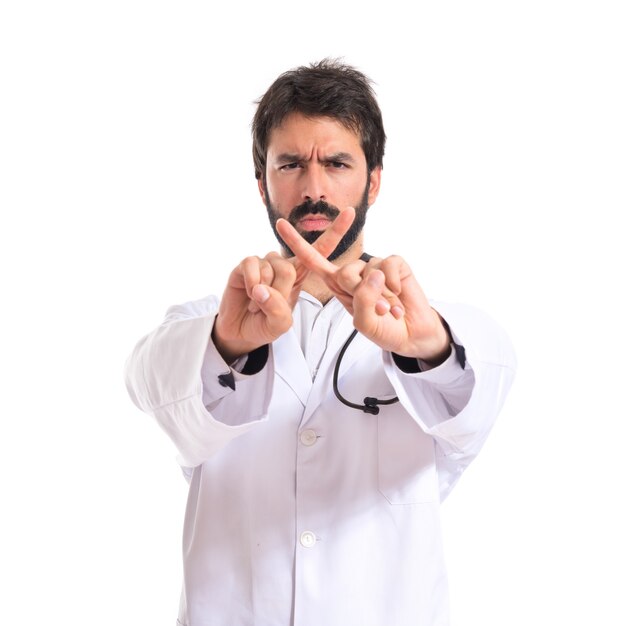 Doctor doing NO gesture over white background