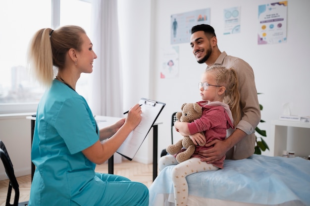 Doctor doing their work in pediatrics office