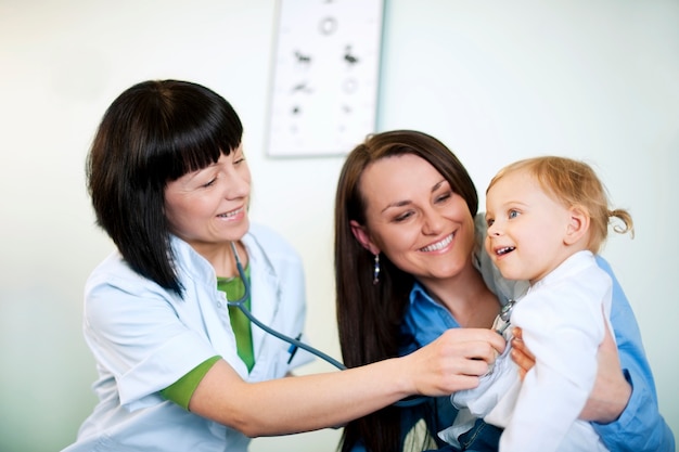 Doctor examining child