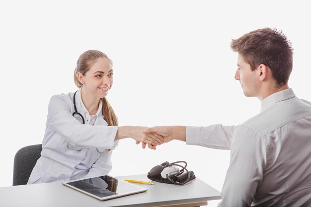 Doctor handshaking with patient