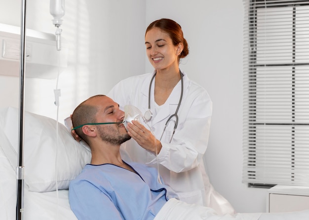 Doctor helping patient medium shot