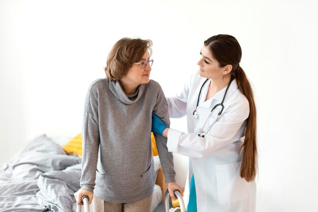 Doctor holding patient medium shot