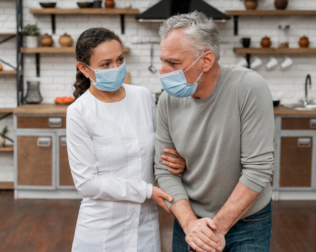 Doctor holding patient in pain