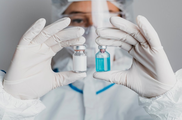 Doctor holding a vaccine bottle