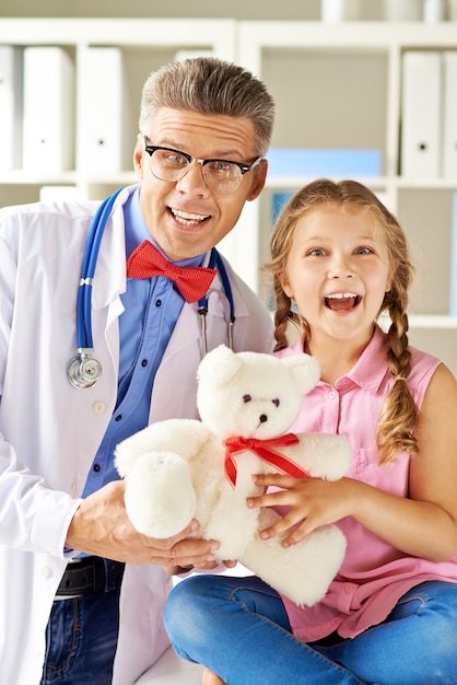 Doctor and little girl laughing