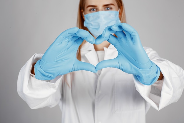 Doctor in a medical mask. Coronavirus theme. Isolated over white background