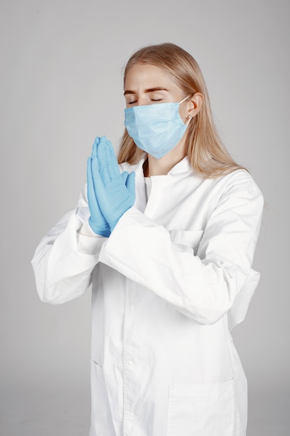 Free photo doctor in a medical mask. coronavirus theme. isolated over white background