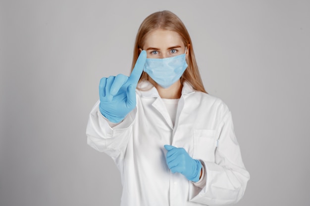 Doctor in a medical mask. Coronavirus theme. Isolated over white background