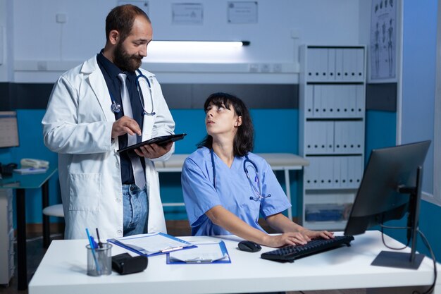 Doctor and nurse doing teamwork for medical checkup