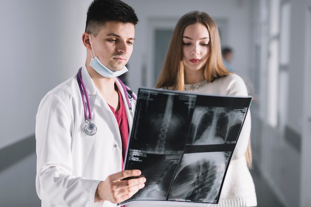 Doctor and patient watching x-ray