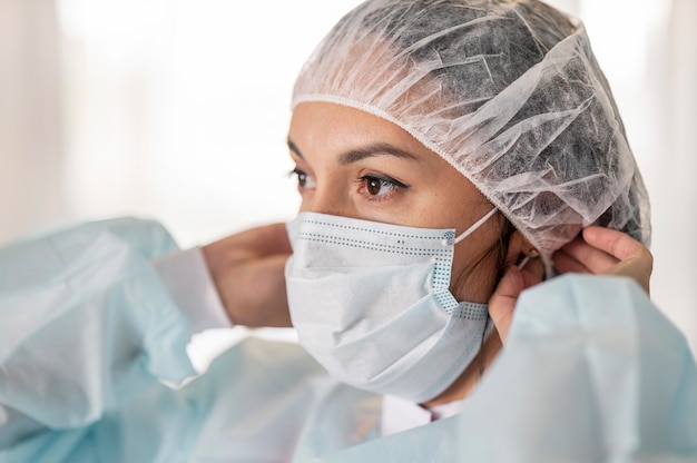 Doctor preparing medical uniform at the hospital