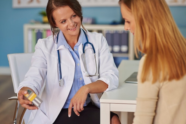 Doctor recommending vitamins to the patient