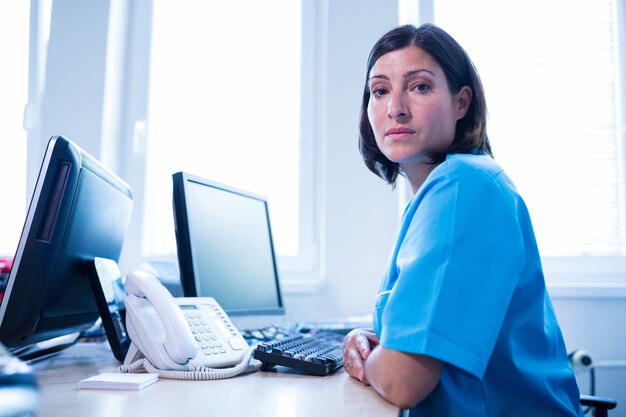 Doctor sitting in medical office at hospital