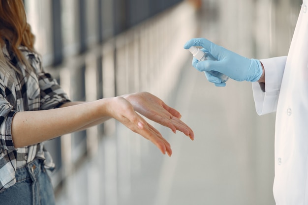 Free Photo doctor sprays the antiseptic on the patient's hands