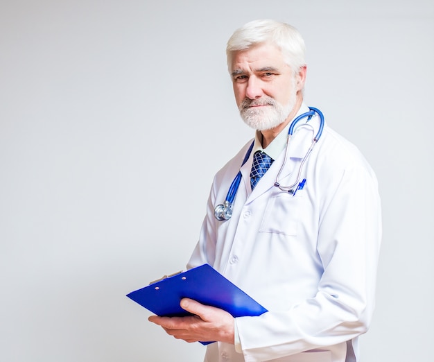 Doctor standing with a folder and a stethoscope