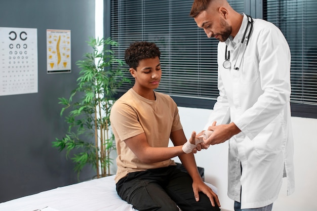 Free photo doctor taking care of afro-american child