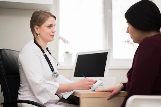 Doctor talking to patient