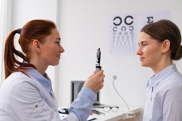 Free Photo doctor testing patient eyesight