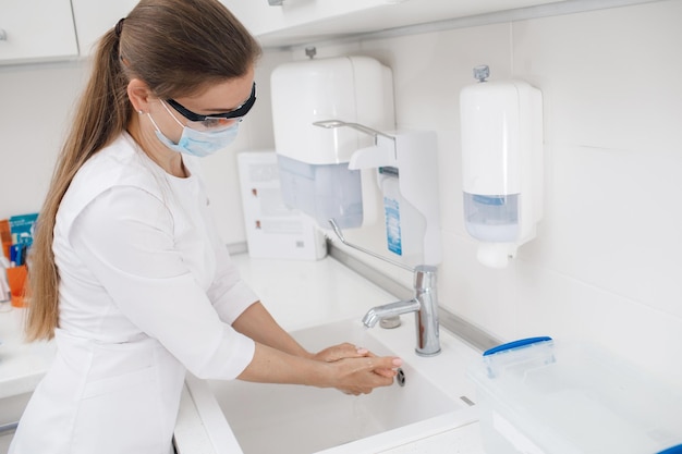 doctor washing her hands