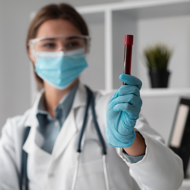 Free Photo doctor wearing face mask at the hospital