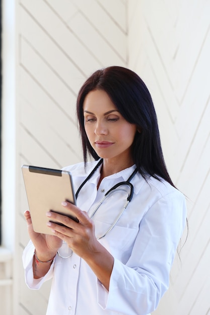 Doctor wearing white robe and stethoscope