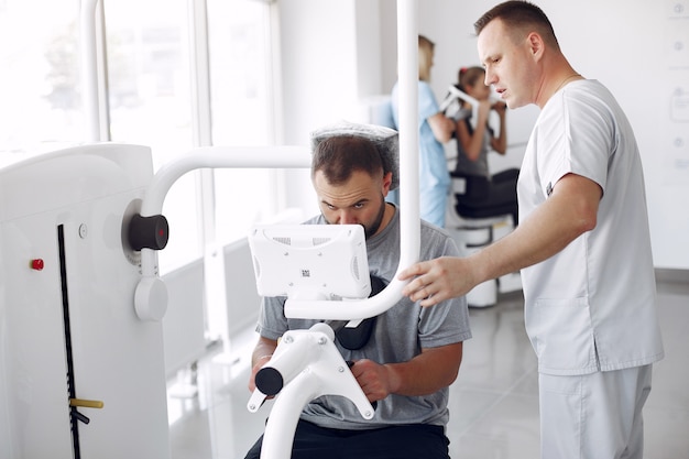 Doctor with a patient in physiotherapy clinic