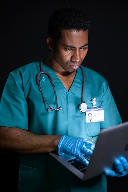 Free Photo doctor working on laptop