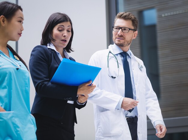 Doctors and nurse interacting while walking