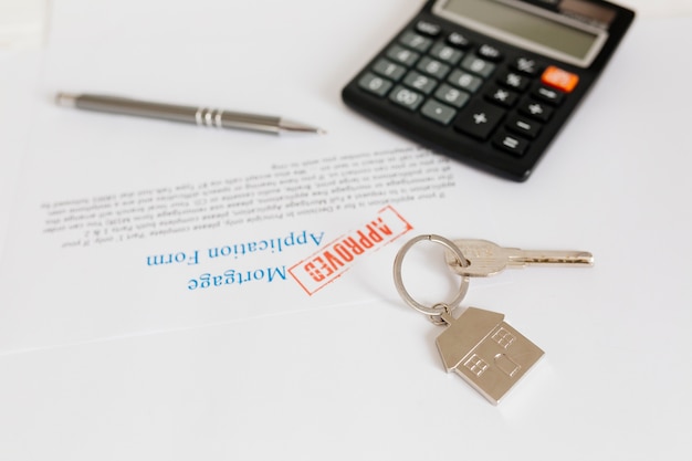 Documents and key on table