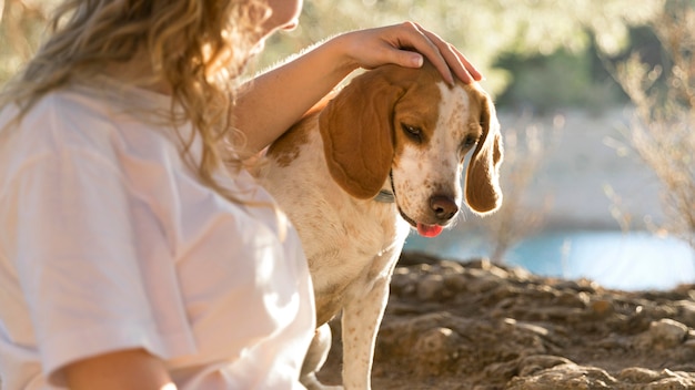 Dog and her owner in the nature