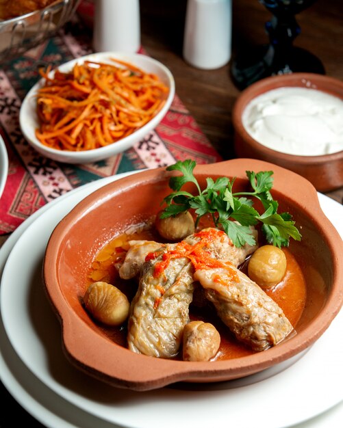 Dolma from cabbage leaves with chestnut in clay pots