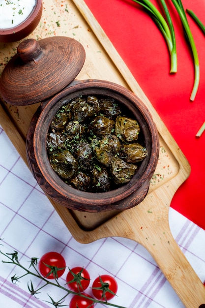 Dolma in leaves topped with herbs