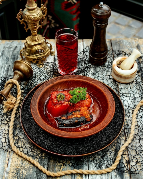 Dolma with stuffed meat in baked tomato and eggplant