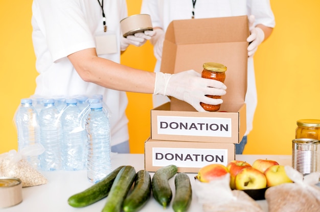 Free photo donation boxes being filled with food