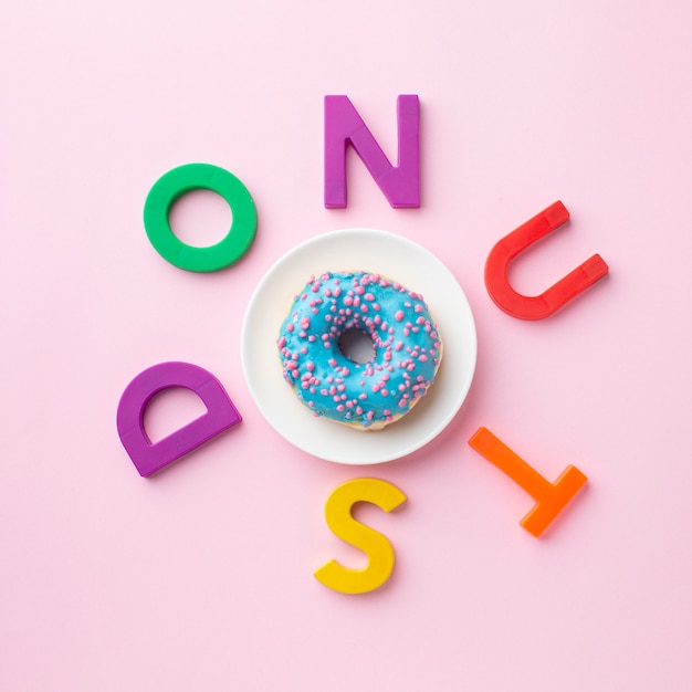 Free photo donut surrounded by letters