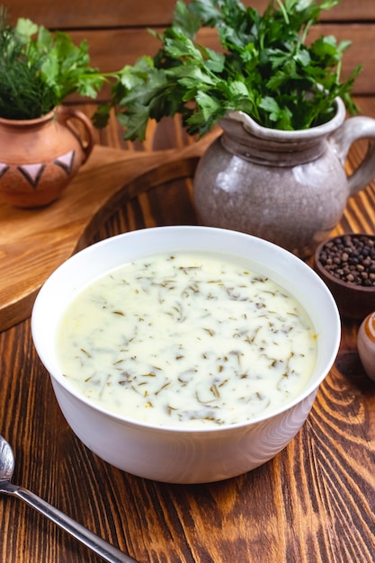 Dovga traditional soup with greens and plain yoghurt side view