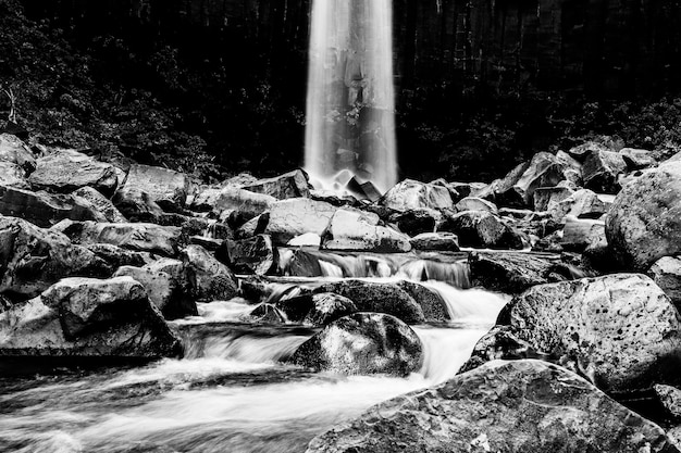 Dramatic black and white waterfall landscape