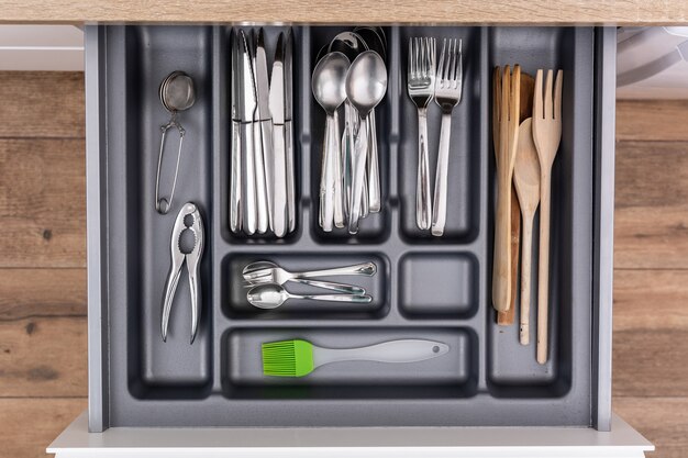 Drawer with cutlery in kitchen