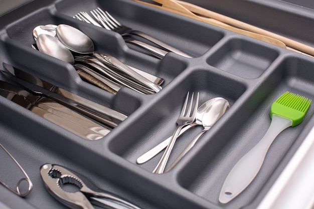 Free photo drawer with cutlery in kitchen