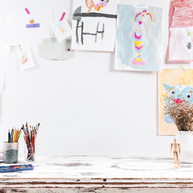 Drawing table with children paintings