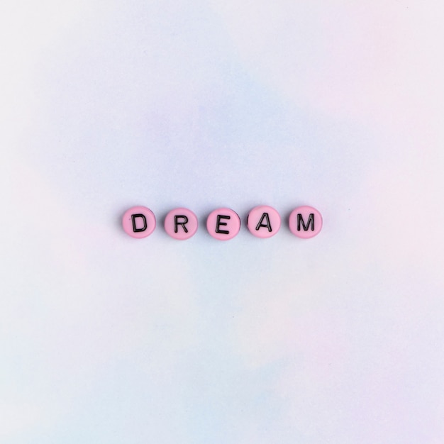 Free photo dream word beads text typography on table