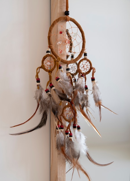 Free Photo dreamcatcher hanging from a mirror