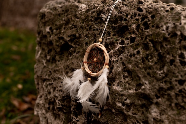 Dreamcatcher hanging from a rock